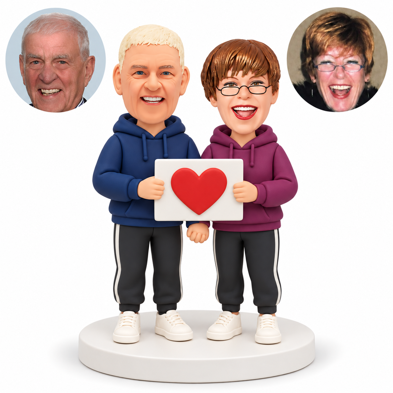 custom bobblehead figures couple in hoodies holding one rectangular heart plaque with their outer hands while their inner hands clasp below it