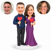 Couple bobbleheads holding separate heart signs while embracing at the waist - MGA-AC1417