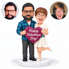 custom bobblehead figures couple embracing at the waist and holding one Happy Valentines Day heart with the woman lifting one foot behind - MGA-AC1427