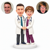 custom bobblehead figures doctor couple in lab coats with a waist embrace and their outer hands clasped in front
