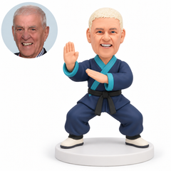 custom bobblehead figure male martial artist in a low stance with one upright palm and the other palm crossing his chest - original own-site polymer clay head and matched photo