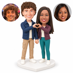 custom bobblehead figures couple in short field jackets and full trousers making a shared heart while holding hands