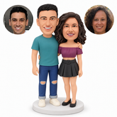 custom bobblehead figures casual couple with man in full jeans and woman in a cropped top and short skirt embracing with their outer arms lowered