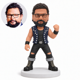 custom bobblehead figure man in a studded open vest and ripped full trousers raising one fist with original polymer clay head and matching real photo