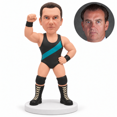 custom bobblehead figure male wrestler raising his right fist above his shoulder with his left hand on his hip with original polymer clay head and matching real photo