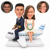 custom bobbleheads figures pilot groom and bride holding a bouquet seated on an airplane