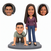custom bobbleheads figures humorous couple with a standing woman holding a chain attached to a man on hands and knees