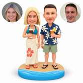 custom bobbleheads figures beach couple each holding a summer drink with their inner arms lowered