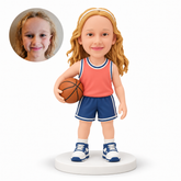 custom bobblehead figure girl basketball player holding a ball at her hip with her other arm lowered