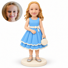 custom bobblehead figure girl holding a round handbag with her other hand resting at her abdomen