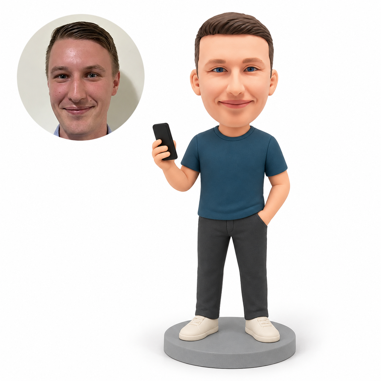 Custom polymer-clay bobblehead figure of a man holding a phone with one hand in his pocket and both feet planted, with original matching portrait