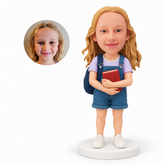 custom bobblehead figure schoolgirl in short overalls holding a book with a backpack
