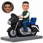 Custom clay bobblehead man riding black broad-front touring motorcycle with blue backrest