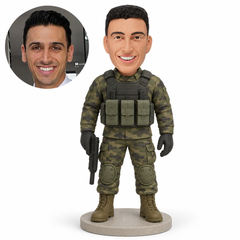 Custom soft-clay bobblehead soldier with protective vest, knee pads and low-held prop