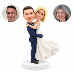 Custom clay wedding couple, groom lifting bride upright in an embrace
