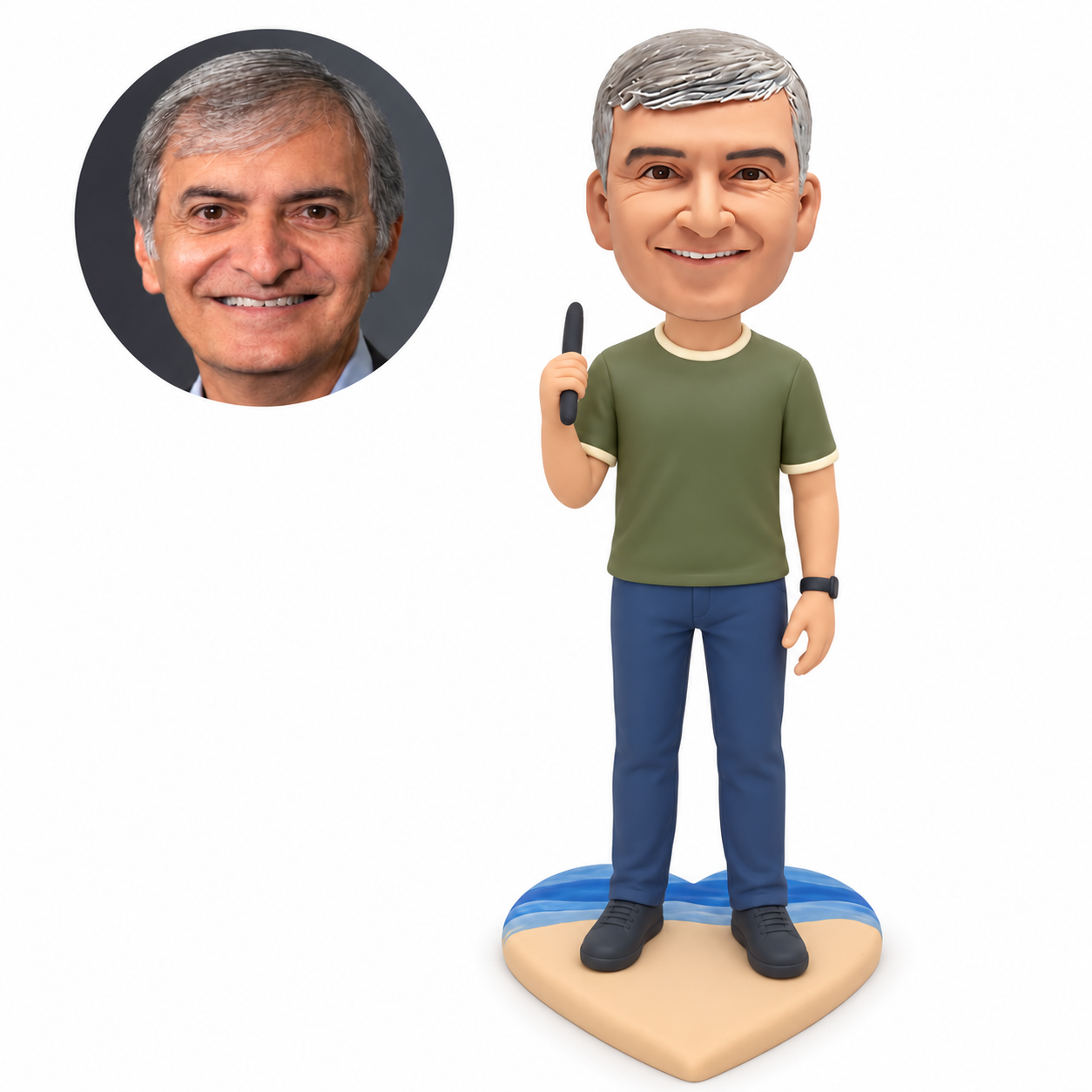 Custom polymer-clay man in an olive-green shirt holding a slim dark upright accessory beside his right shoulder, with his empty left arm lowered, on a heart-shaped tan and blue beach base with matching real portrait