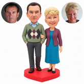 custom bobblehead figures couple with both his hands in pockets and her hand linked around his arm