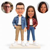 Custom clay couple in casual jackets, outer hands in trouser pockets, his inner empty arm lowered, four white sneakers on a rectangular base, paired reference photos — MGA-AC1788