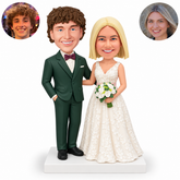 Custom clay wedding couple: groom left with right hand in trouser pocket and arm behind bride; bride right with right forearm around his waist and left hand holding a white bouquet. Original sculpted heads and matching real photo circles.