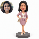 custom bobblehead figure woman with a wrist handbag and crossed ankles