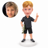 custom bobblehead figure boy angler in shorts holding a fish and raising one finger