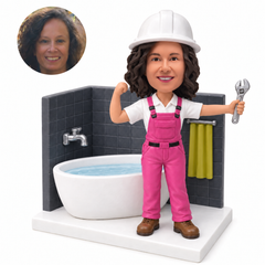 custom bobblehead figure female plumber raising a wrench beside a bathtub and tiled wall