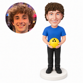 custom bobblehead figure male bowler holding a bowling ball with both hands