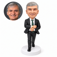 custom bobblehead figure man in a suit stepping forward while adjusting his cuff