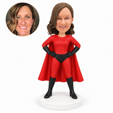 custom bobblehead figure woman in a full superhero suit and cape with both hands on her hips