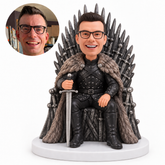 custom bobblehead figure man in black armor seated on a throne holding a sword