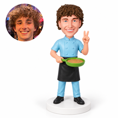custom bobblehead figure male chef holding a frying pan and making a peace sign