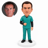 custom bobblehead figure male medical worker in scrubs over long sleeves with one hand near his waist