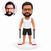 custom bobblehead figure man in a tank top and shorts holding two paddles at his sides