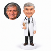 custom bobblehead figure male doctor with a stethoscope holding a book with his other arm down