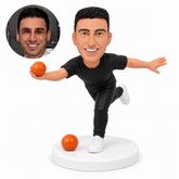 custom bobblehead figure male bocce player balancing on one leg with outstretched arms