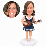 custom bobblehead figure woman in a sailor-collar dress playing a ukulele