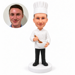 custom bobblehead figure male chef in a white coat and hat holding a bowl and spoon