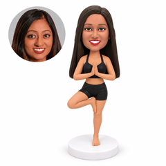 custom bobblehead figure woman in a short yoga outfit in tree pose with hands together