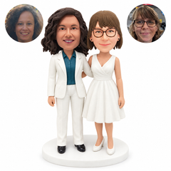 custom bobblehead figures two women in a white trouser suit and knee length wedding dress