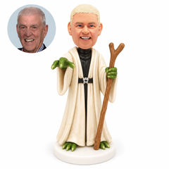 custom bobblehead figure fantasy character in a long cream robe holding a walking staff