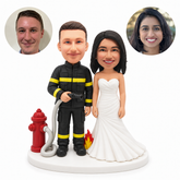 custom bobblehead figures firefighter groom and bride beside a hydrant and hose