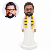 custom bobblehead figure man in a full-length white thobe with a striped scarf