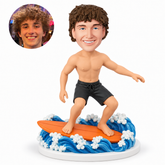 custom bobblehead figure shirtless man surfing on a board over sculpted waves