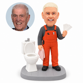 custom bobblehead figure workman in overalls holding samples beside a toilet