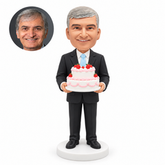 custom bobblehead figure man in a suit holding a large two-tier birthday cake
