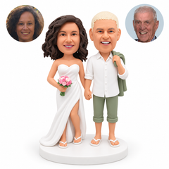 custom bobblehead figures beach wedding couple with the man in a button-front shirt and cropped trousers and the woman in a strapless slit gown