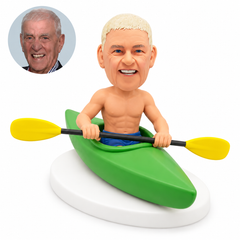 custom bobblehead figure shirtless man seated in a kayak holding a double-bladed paddle across the cockpit
