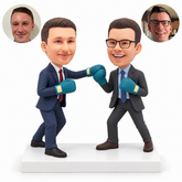 Two businessmen facing one another in a friendly boxing sparring pose, with four teal gloves.
