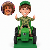 custom bobblehead figure farmer giving two thumbs up while seated on a tractor