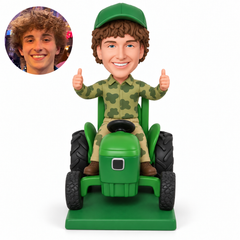 custom bobblehead figure farmer giving two thumbs up while seated on a tractor
